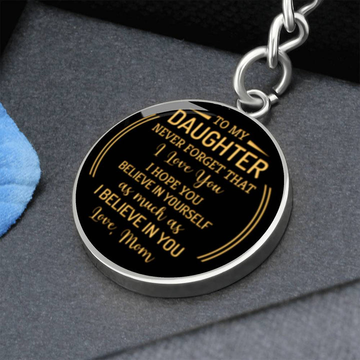 _t0247_ ShineOn, Graphic Circle Pendant with KeyChain, a shatter Proof liquid glass coating and 14K Gold finish options.