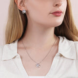ShineOn, Love Knot earings &  Necklace with brilliant 14k white gold over stainless steel, surrounding a dazzling 6mm cubic zirconia crystal, 18-22 inch